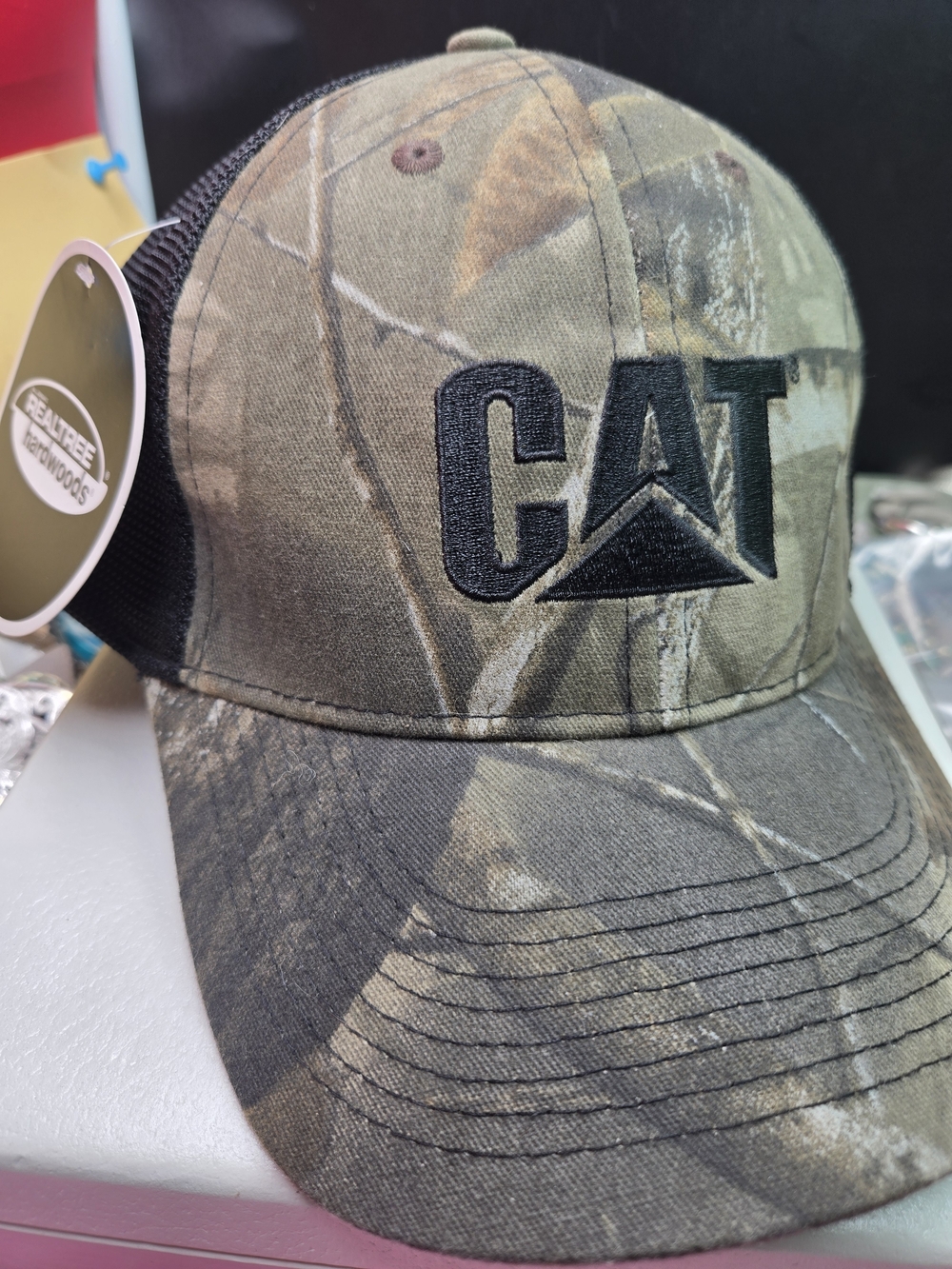 Realtree CAT Logo Camouflage Trucker Hat in Green and Brown